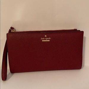 maroon Kate spade wallet.